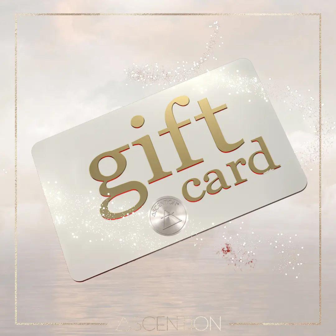 The ASCENTION GIFT CARD presented by Ascention Beauty - Wellness Clean Cruelty-Free Vegan Perfume is a white card adorned with "gift card" in gold text, encapsulating elegance and inspiration. It features a dazzling design highlighted by a round emblem engraved with ASCENTION, set against a gentle mix of pastel hues and sparkles that symbolizes the empowerment found in giving.