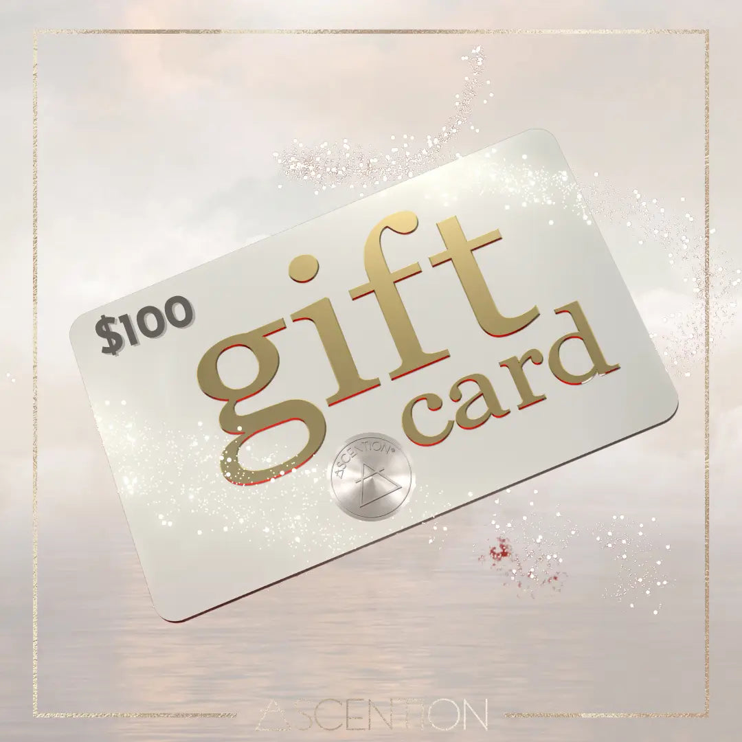 Introducing the $100 ASCENTION GIFT CARD, featuring "gift" in prominent gold letters and "card" in smaller text for an empowering touch. The Ascention Beauty - Wellness Clean Cruelty-Free Vegan Perfume logo is beautifully set against a soft, cloudy background with a gentle sparkle effect, inspiring motivation with every gesture.
